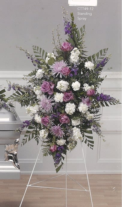 Purple and white funeral standing spray with roses and chrysanthemums on easel, Barrie florist