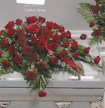 Red rose casket spray arrangement on silver casket, Joshua's Greenery Barrie florist