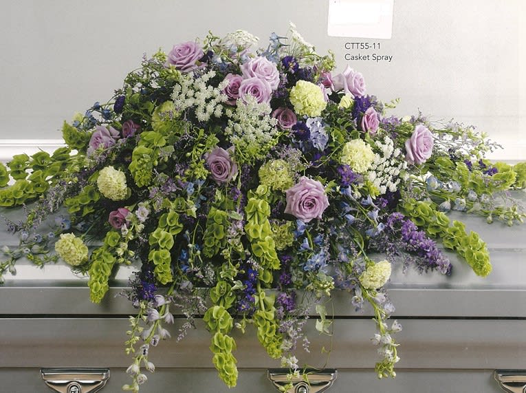 Lavender and green casket spray with roses and greenery at Joshua's Greenery Barrie Florist.