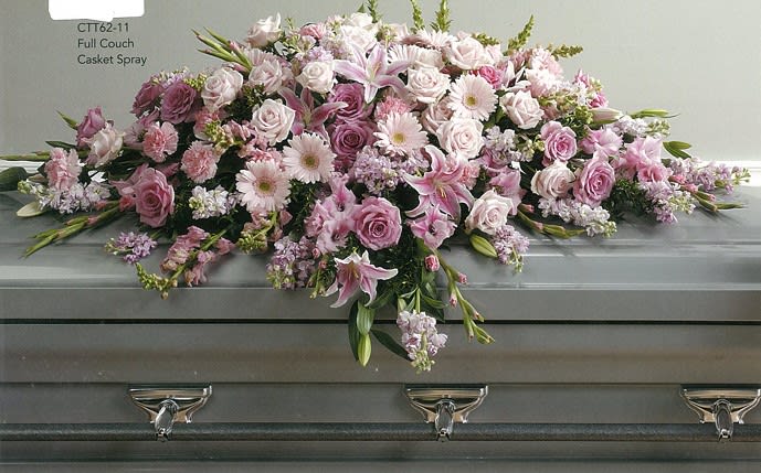 Pink and white sympathy casket spray with roses and lilies on a gray casket, Joshua's Greenery Barrie Florist