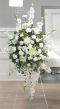 White funeral standing spray with roses and lilies on easel, Joshua's Greenery Barrie florist