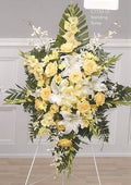 Yellow and white funeral standing spray with lilies and roses, floral arrangement by Joshua's Greenery