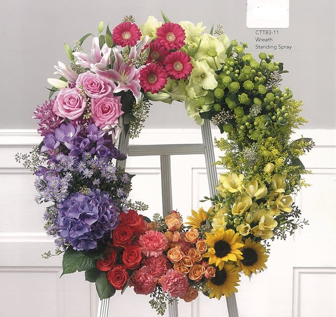 Colorful floral wreath with roses, sunflowers, lilies on a stand, Joshua's Greenery Barrie Florist