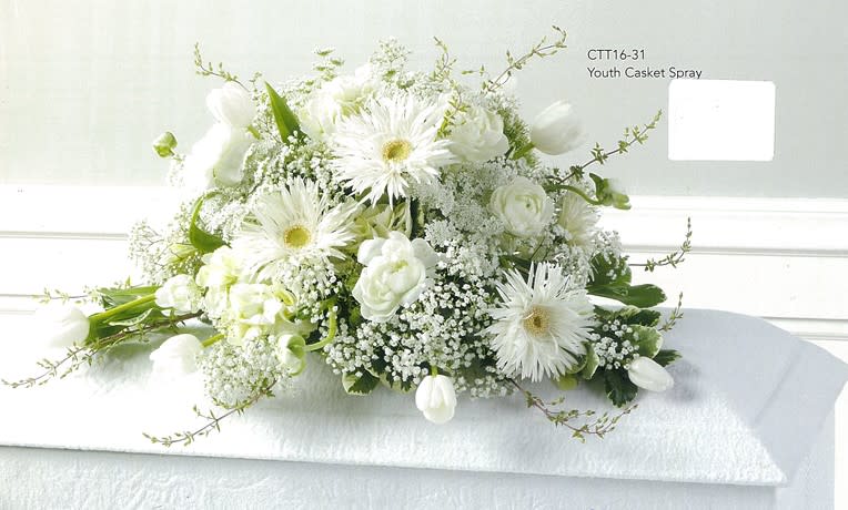 White casket spray with daisies and roses, floral arrangement from Joshua's Greenery Barrie Florist.