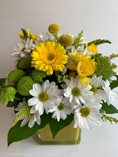 Yellow and white flower arrangement in green vase, Barrie florist Joshua's Greenery.