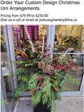 Custom Christmas urn arrangement with pine, berries, and cones at Joshua's Greenery Barrie Florist