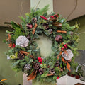 Festive evergreen wreath with pinecones, berries, lotus pods, and cinnamon sticks by Joshua's Greenery Barrie florist