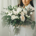 Bride holding elegant white rose bouquet with greenery, Joshua's Greenery Barrie Florist