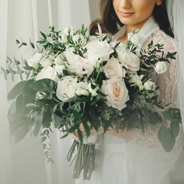 Bride holding elegant white rose bouquet with greenery, Joshua's Greenery Barrie Florist
