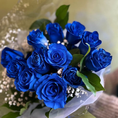 Bouquet of vibrant blue roses with greenery from Joshua's Greenery Barrie Florist