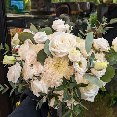 White rose bouquet with greenery at Joshua's Greenery Barrie Florist shop.