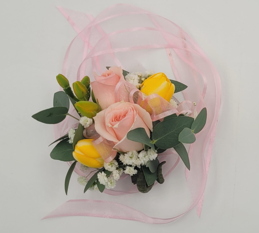 Pink and yellow corsage with roses, greenery, and pink ribbon from Joshua's Greenery Barrie Florist