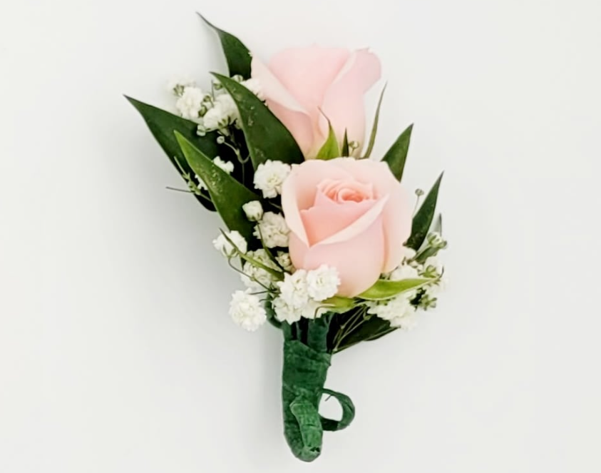 Pink rose boutonniere with white baby's breath and greenery by Joshua's Greenery Barrie Florist