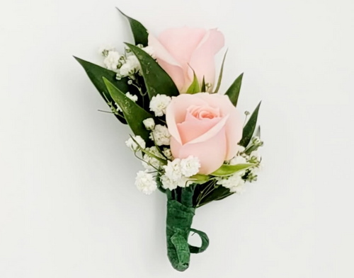 Pink rose boutonniere with white baby's breath and greenery by Joshua's Greenery Barrie Florist