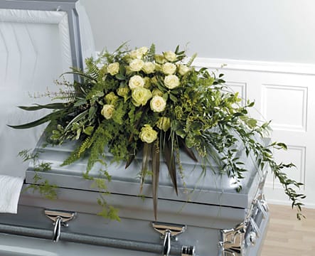 White rose funeral casket spray with greenery by Joshua's Greenery Barrie Florist