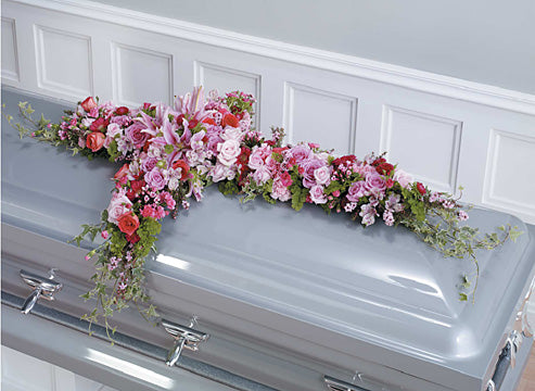Pink and Magenta cross casket spray