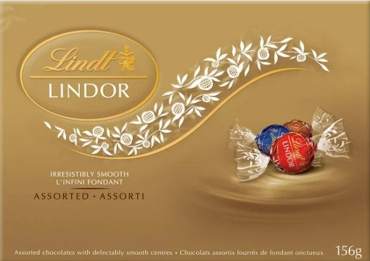 Lindt Lindor assorted chocolate truffles box on a gold background, featured at Joshua's Greenery-Barrie Florist.